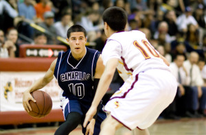 Jacob Alonzo, senior, dribbles the ball as Camarillo's captivated audience awaits the following few seconds.