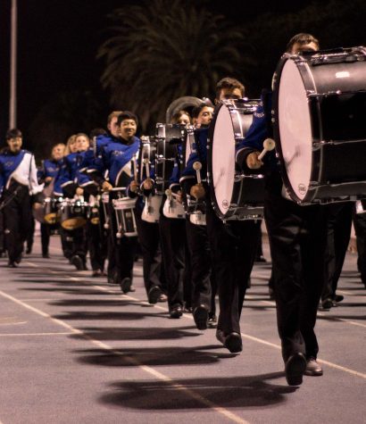 Cam High's Marching Band marches to the field. Director Mr. John Stava said the band's improvement this year has been