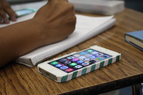 Athena Quddus, freshman, working on a class project using her iOS 7 device.