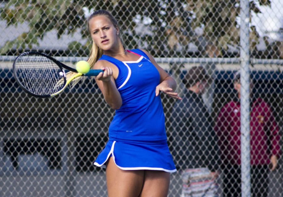 Sara+Downey%2C+junior%2C+takes+a+forehand+shot+at+the+Cam+High+girls+varsity+tennis+team+practice+court.
