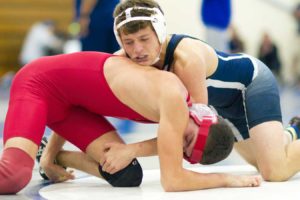 Logan Watkins, senior, tackles a Hueneme High School opponent to the ground. Photo By: James Schaap Photography Editor