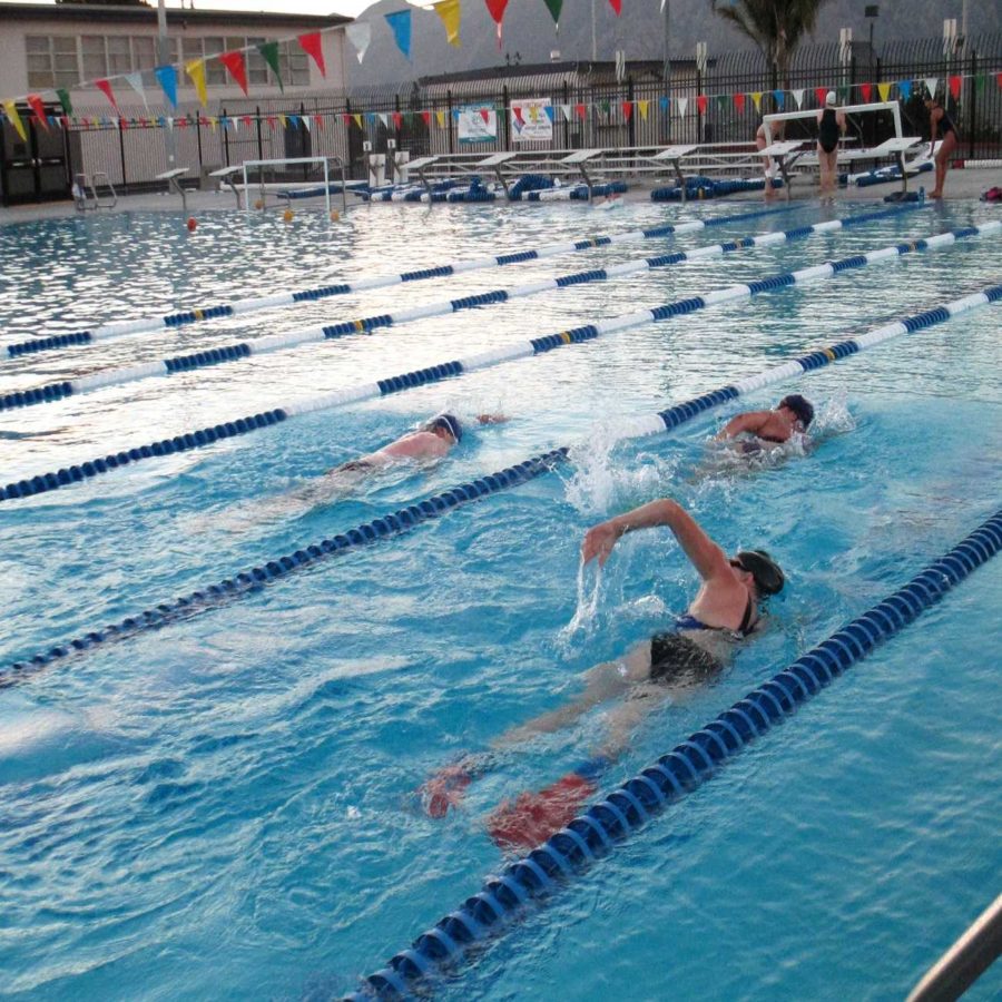 Teachers including Mr. Matthew Doyle (far left) swim laps during lunch as part of their new pool privileges.