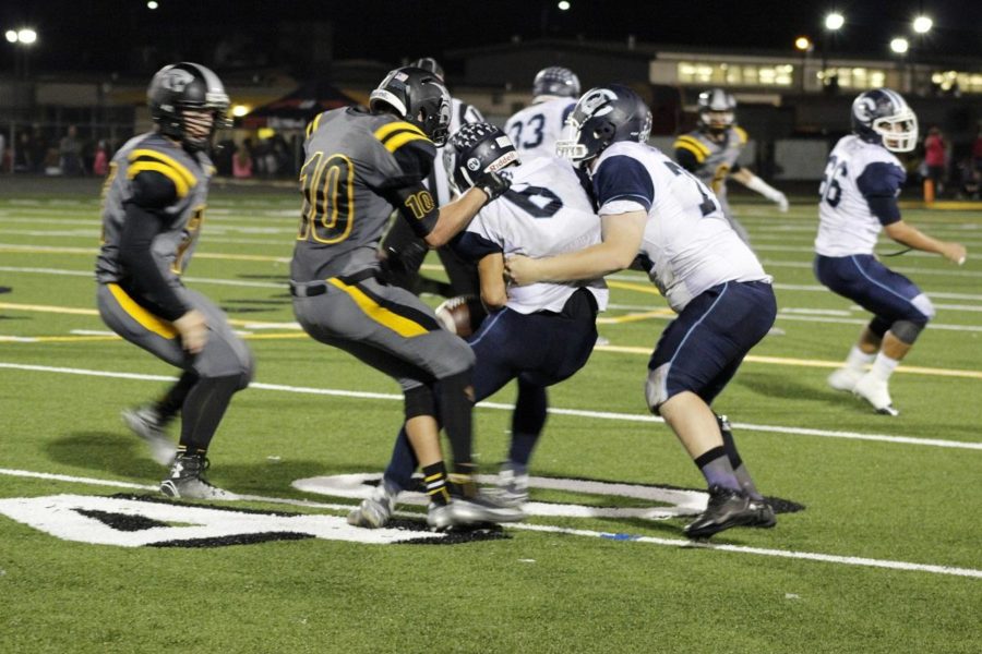 Junior Casey Bash being tackled during an offesive play. Cam High lost to Newbury Park 28-53 last Friday night.