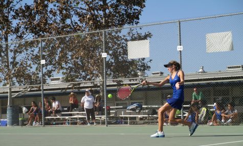 No. 2 varsity singles player Tatiana Anderson goes for the win on the Cam High girl's tennis team.