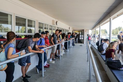 Students wait in line to purchase lunch from the cafeteria.
