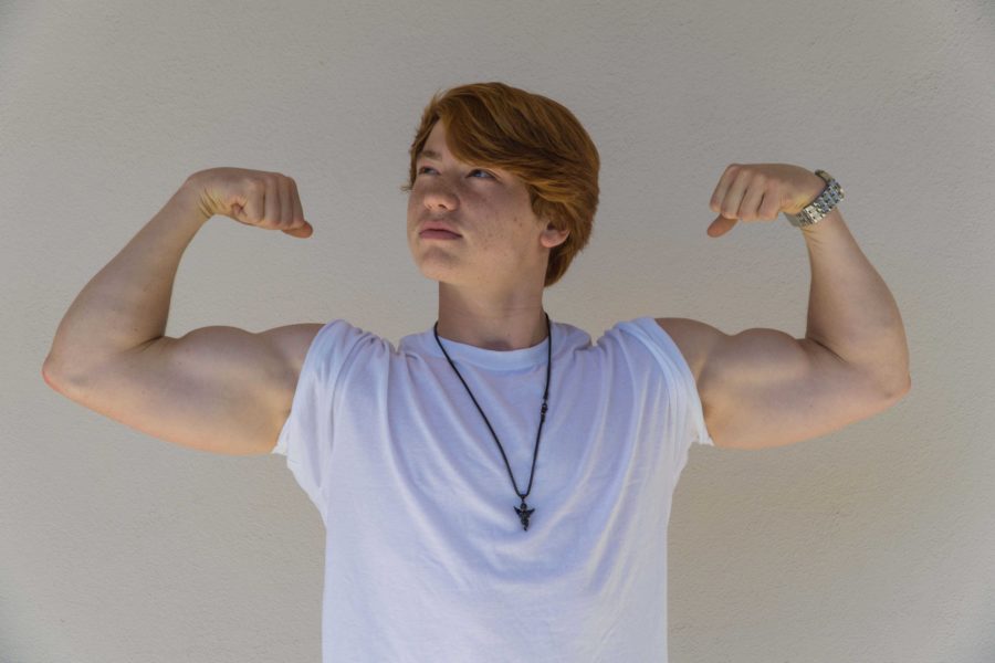 Cam High junior Matt Ullerick shows off his biceps to the camera. Ullerick has been working to become a professional bodybuilder for the past year.
