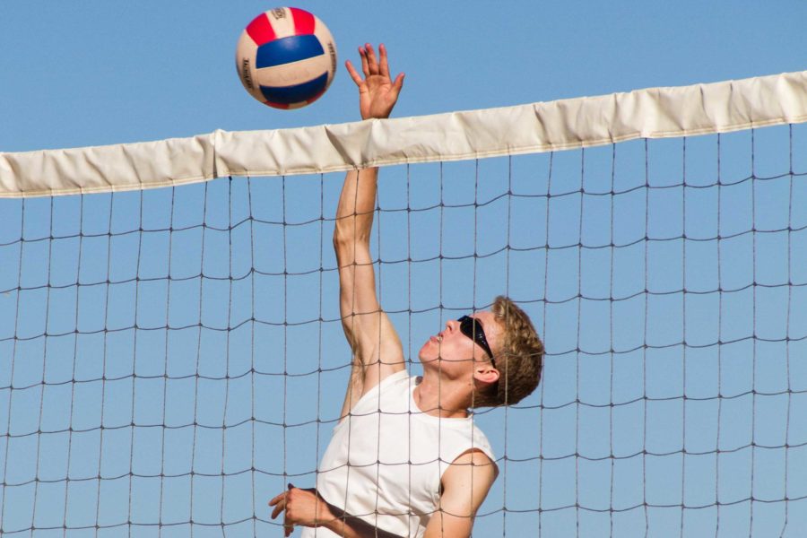 John Paul Dillard, third year beach volleyball player and senior, attacks the ball at a tournament in Ventura Harbor.
