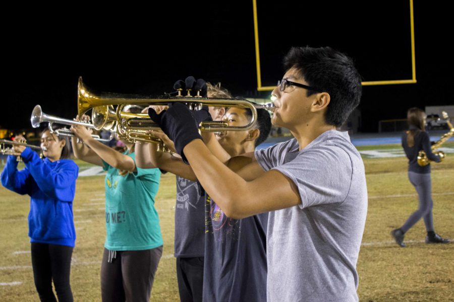 Trumpet+player+Logan+Villalobos%2C+sophomore%2C+rehearsing+through+the+marching+bands+field+show+called+Homesick.
