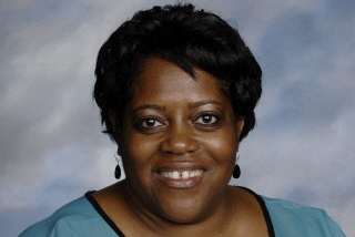 Mrs. Melvina Barnes, former math, English, and directive studies teacher at Cam High.