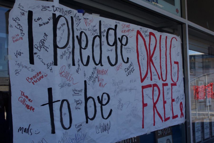 Students sign I Pledge to be Drug Free poster to show commitment to their drug free lifestyle.