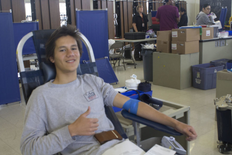 Jacob Curren donating blood at Cam Highs bi-annual blood drive. Photo by Shaeley Hicks. 