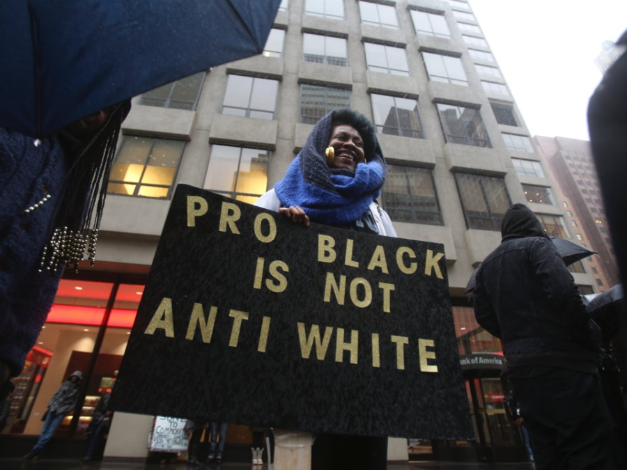 A Black Lives Matter protester holds a sign in support of singer Beyonce during a rally outside the NFL Headquarters building in the Manhattan borough of New York, Feb. 16, 2016. Reuters/Carlo Allegri