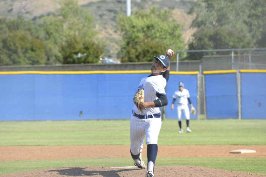 Photo by: Gabi Jose 
Pitcher and freshman Brian Uribe throwing a pitch against Sierra Canyon.