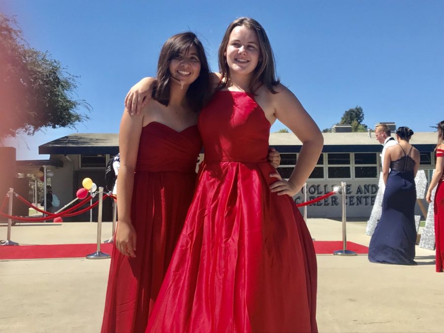 Assistant Drum Majors Katelyn Raney and Kaylie Pritchard pose for a picture after the Homecoming Fashion Show.
