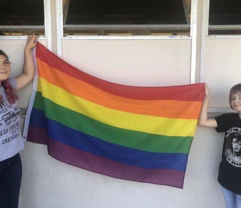 Kayla Stevenson (left) and Bethany Diaz (right) of the GSA club hold a pride flag.
Photo by: Ian Lattimer
