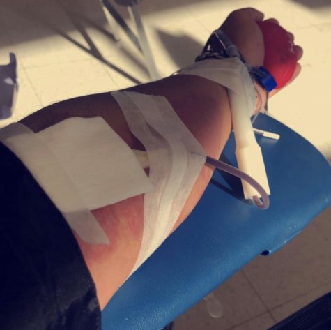Ethan Francisco (senior) donating blood on Wednesday, December 12, 2018, at the ACHS blood drive.