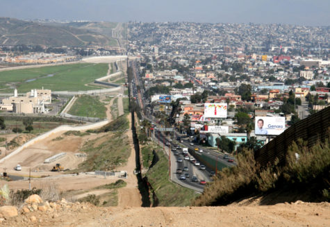 A small fence separates densely populated Tijuana, Mexico (right) from the United States in the Border Patrol's San Diego Sector.