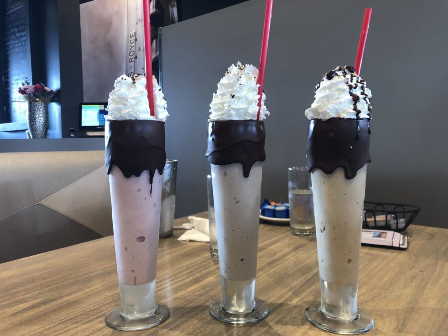A Strawberry milkshake, Oreo milkshake, and Creamy Coffee milkshake served at Waypoint Cafe.