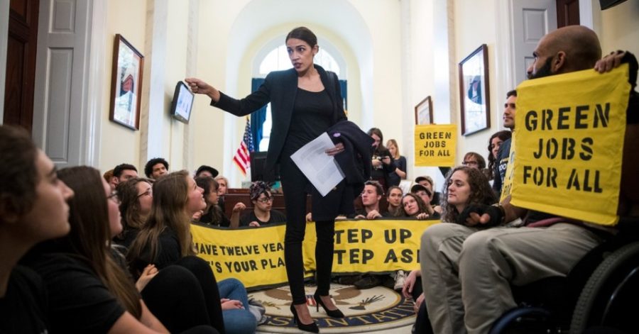 Representative Alexandria Ocasio-Cortez speaks to activists in the offices of House Minority Leader Nancy Pelosi.