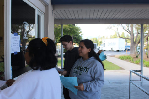 Students purchasing AP tests on March 7, 2019. From left to right Gabrielle Domingo, Victoria Paniagua, and Adrian Wasylewski.