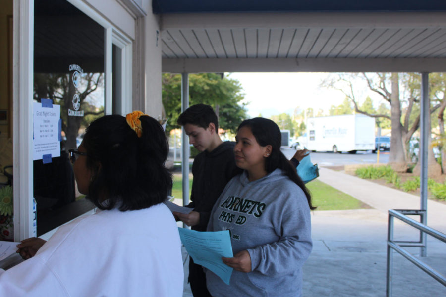 Students purchasing AP tests on March 7, 2019. From left to right Gabrielle Domingo, Victoria Paniagua, and Adrian Wasylewski. 