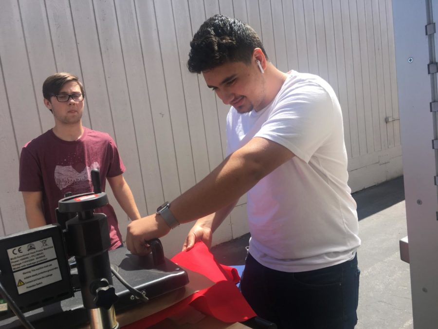 Jonny Samaan helping Justin Terryberry with the T-Shirt Press.