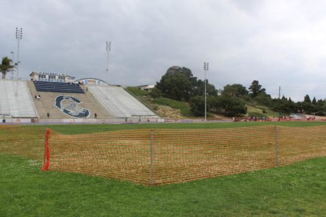 Cam High's field has been partially surrounded by an orange plastic mesh fence in preparation for the upcoming work on the field.