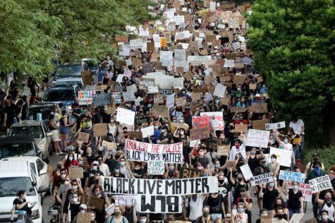 Protesters march in the streets of Chicago to protest police brutality and racism in America.