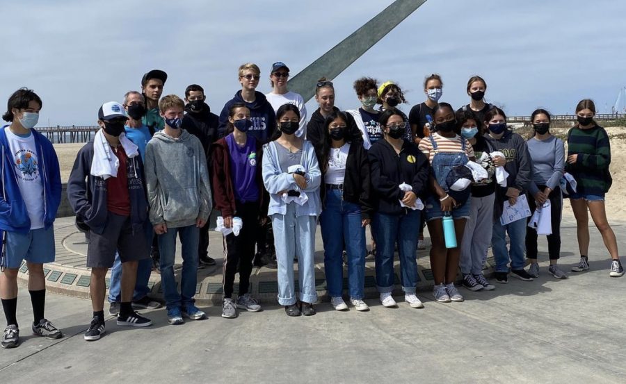 KIWINS Club members at a beach in Oxnard after participating in a beach cleanup there!