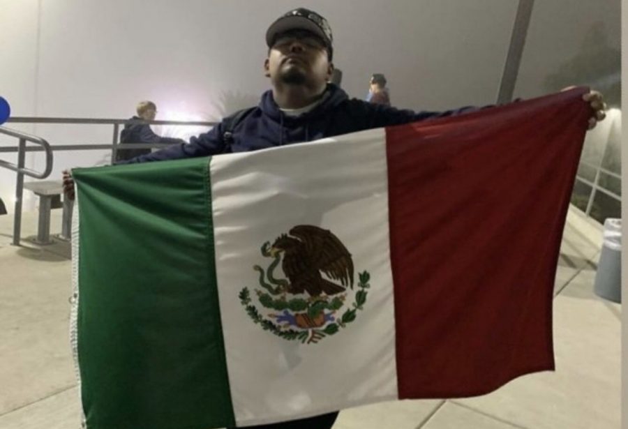 Cesar Perez shows off his Mexican flag after being ejected from the stadium.