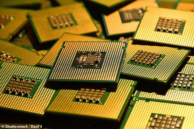 A number of silicon chips are depicted, scattered and stacked on top of each other.