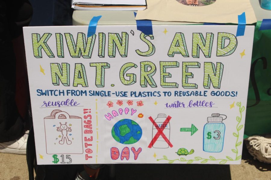 Kiwins booth Naturally Green sign.